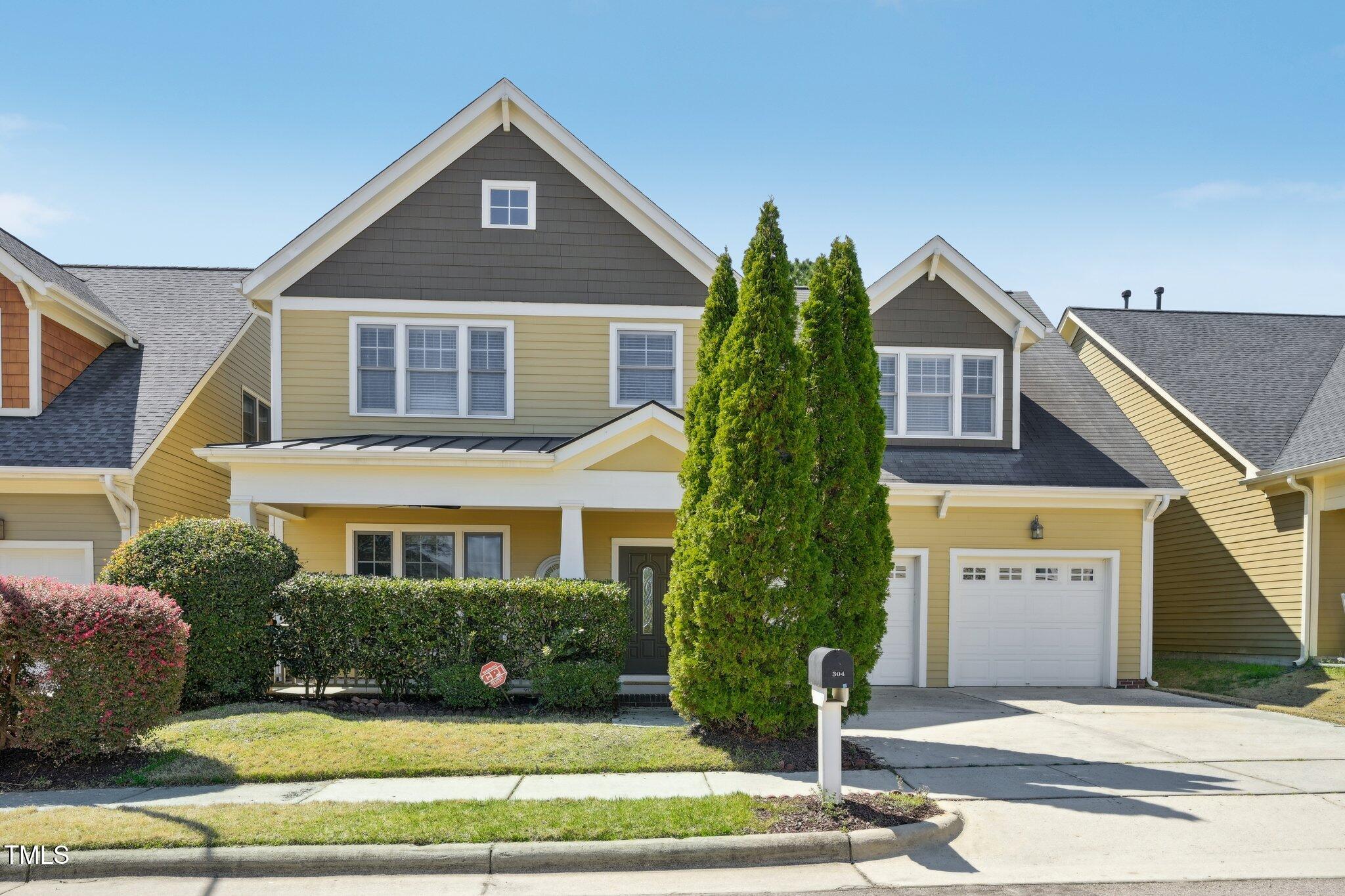 304 Frontgate Drive Cary, NC 27519 - Photo 1 of 41 a front view of a house with a yard