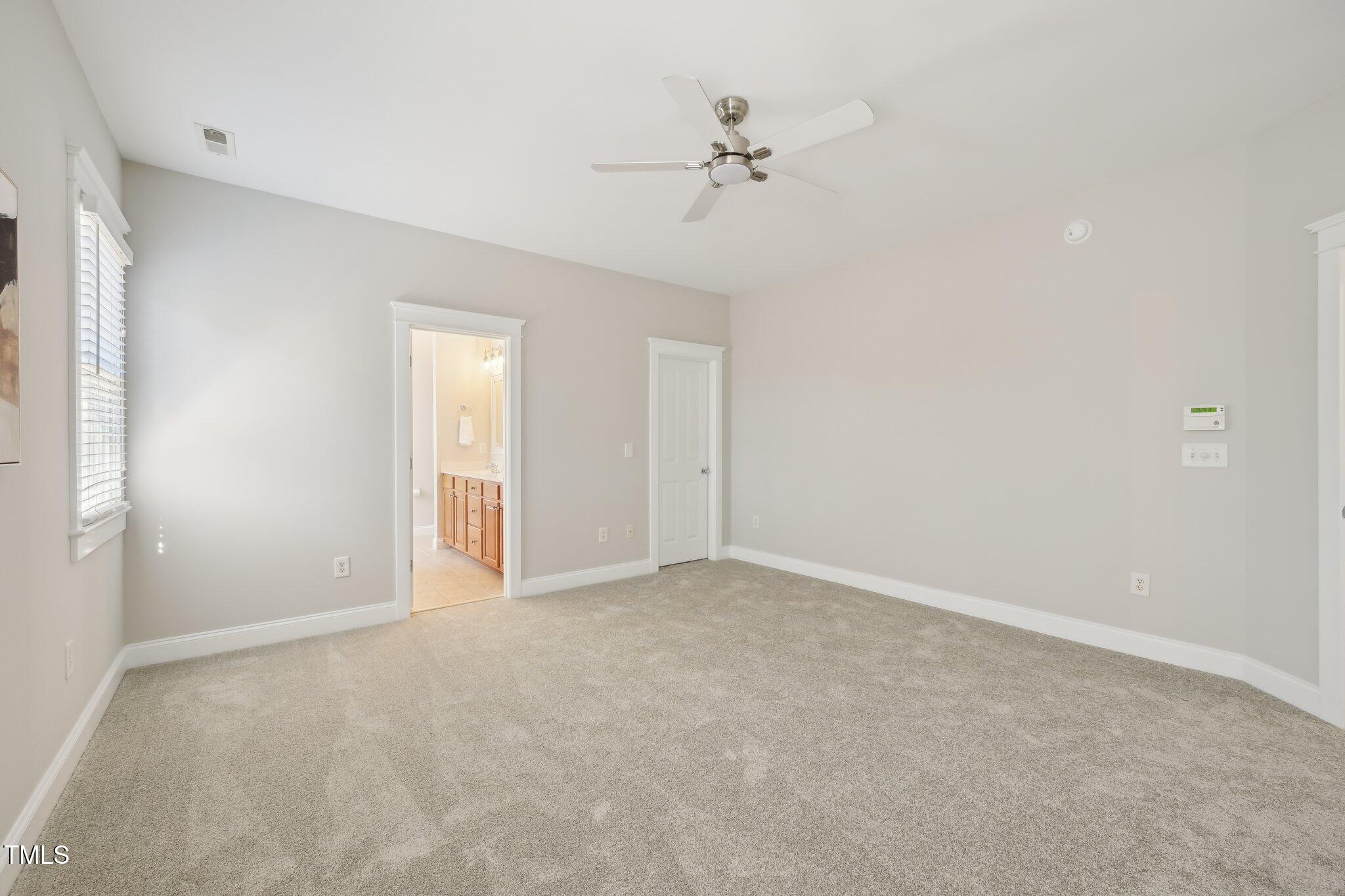 304 Frontgate Drive Cary, NC 27519 - Photo 20 of 41 a view of an empty room with a fan