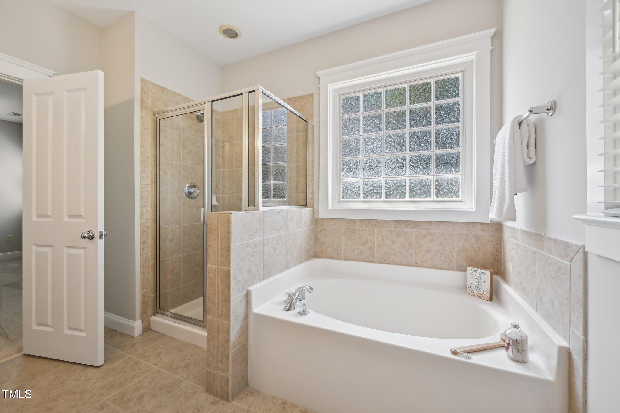 304 Frontgate Drive Cary, NC 27519 - Photo 22 of 41 a white bath tub sitting next to a window