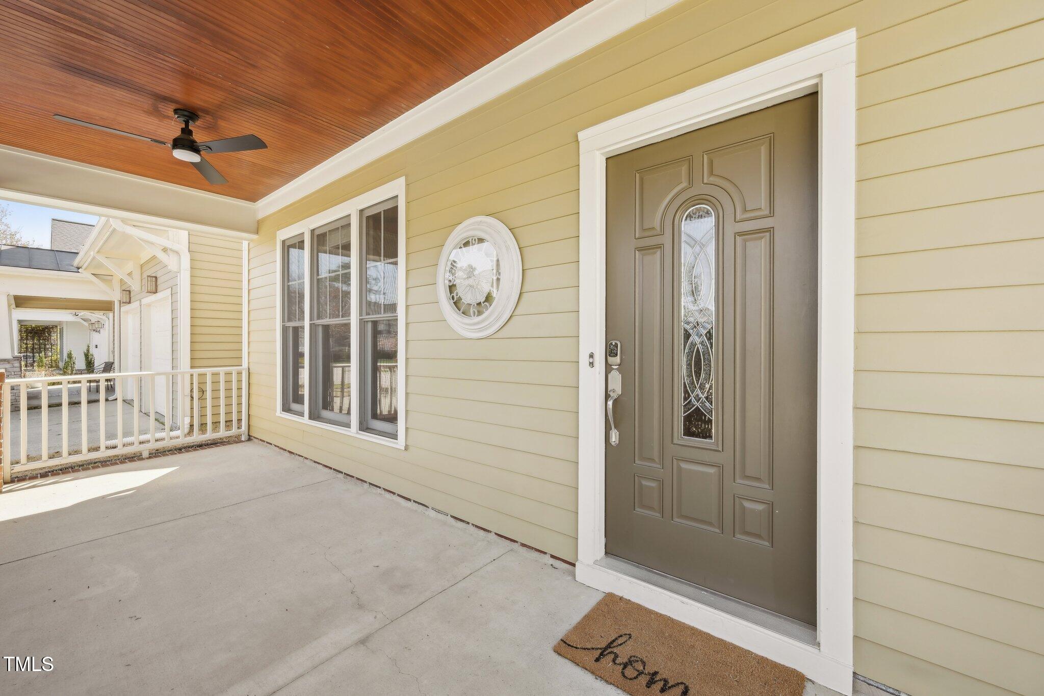 304 Frontgate Drive Cary, NC 27519 - Photo 3 of 41 a view of a hallway with wooden floor and a front door