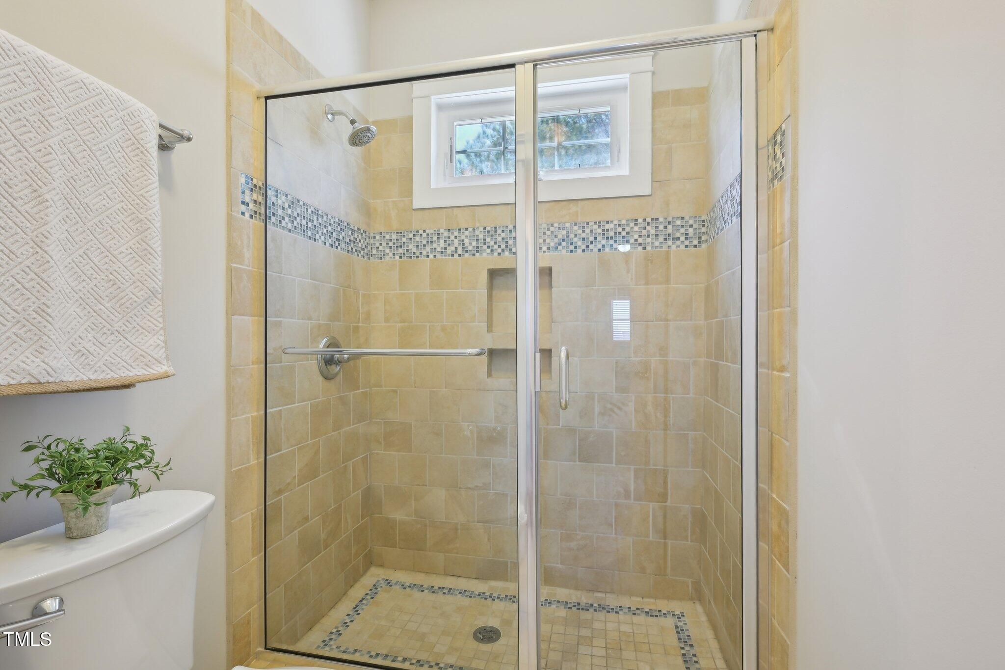 304 Frontgate Drive Cary, NC 27519 - Photo 31 of 41 a bathroom with a shower