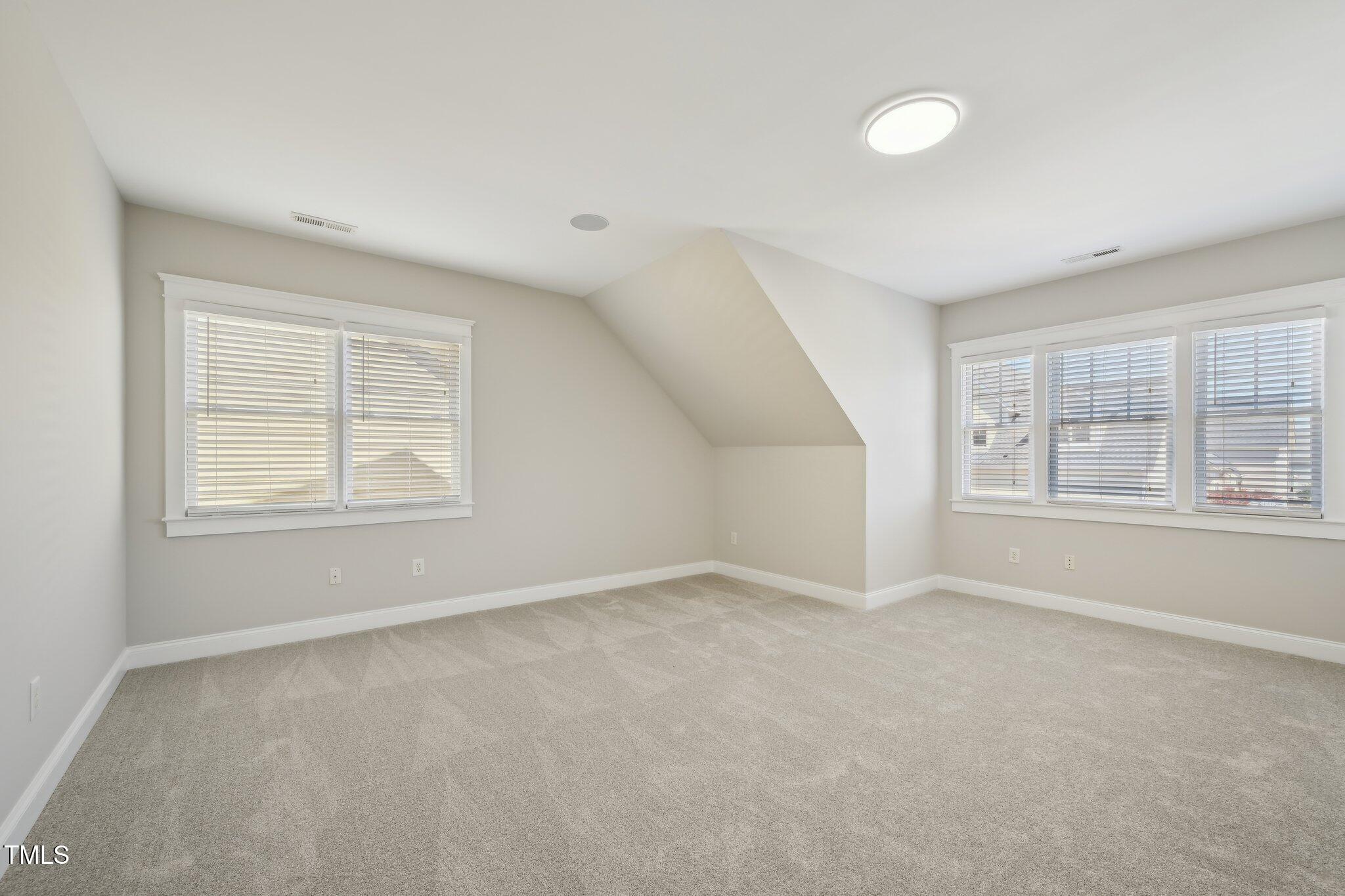 304 Frontgate Drive Cary, NC 27519 - Photo 33 of 41 an empty room with windows and closet