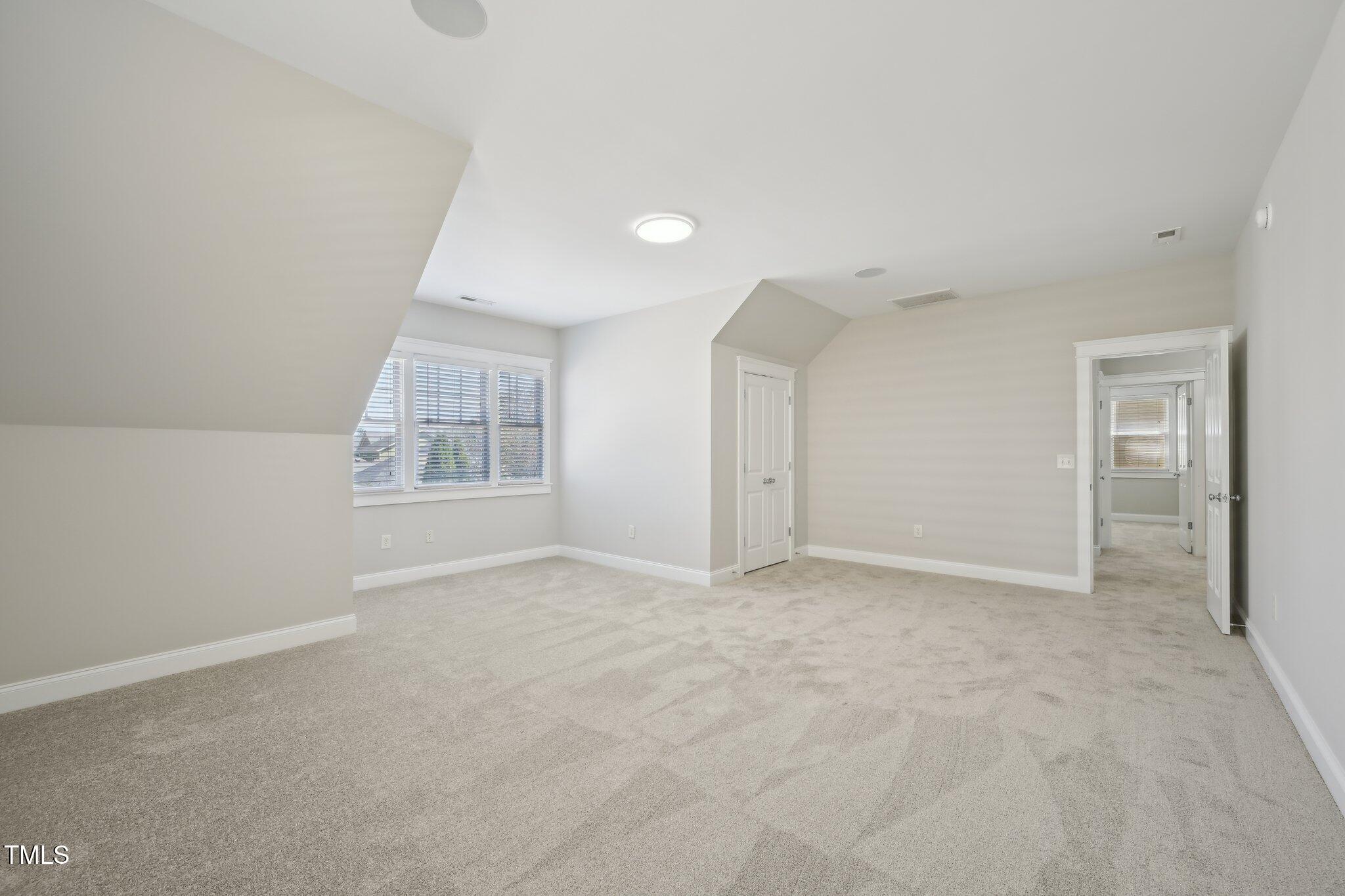 304 Frontgate Drive Cary, NC 27519 - Photo 34 of 41 an empty room with windows and closet