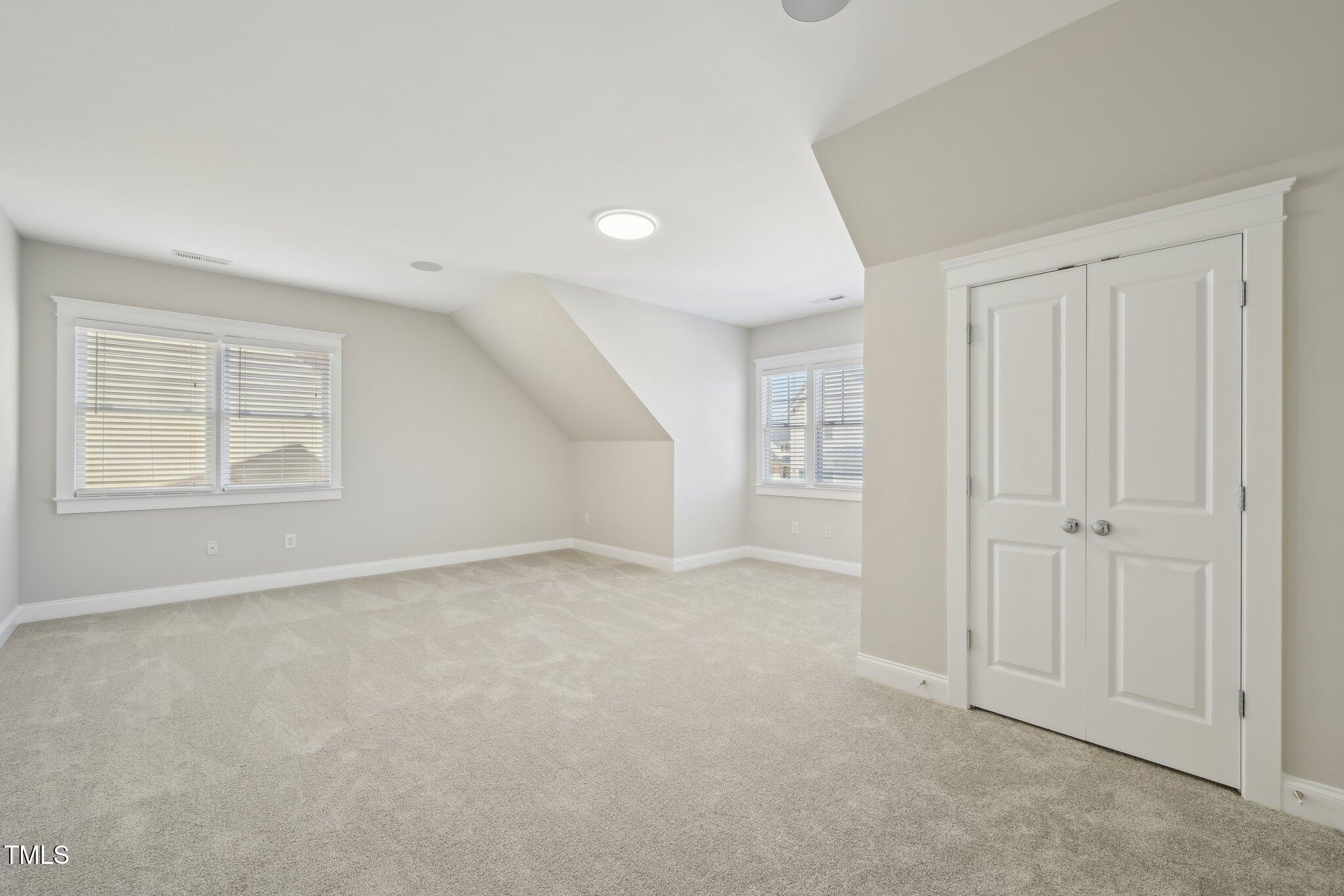 304 Frontgate Drive Cary, NC 27519 - Photo 35 of 41 an empty room with windows and closet