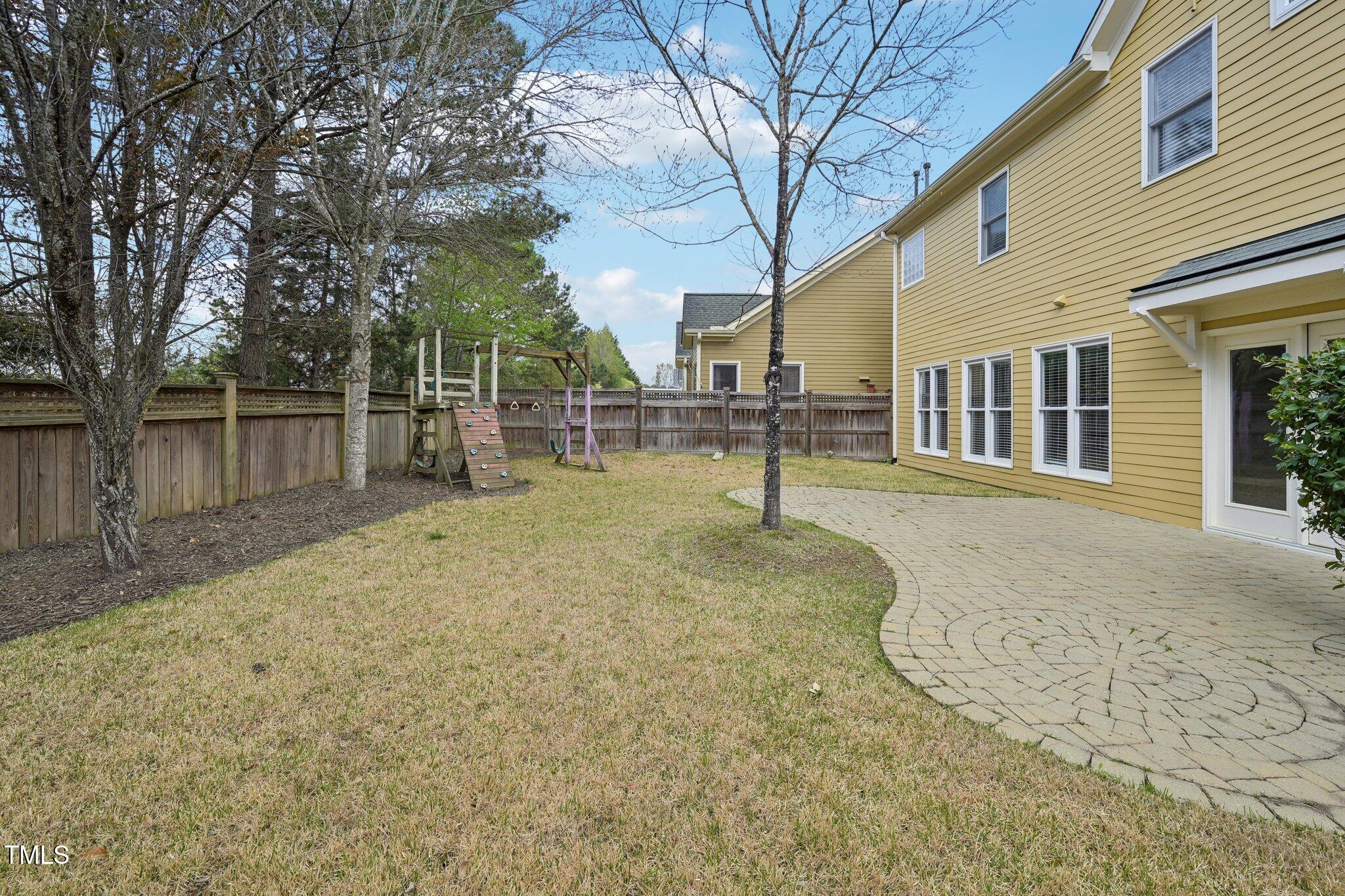 304 Frontgate Drive Cary, NC 27519 - Photo 39 of 41 a backyard of a house with lots of tree