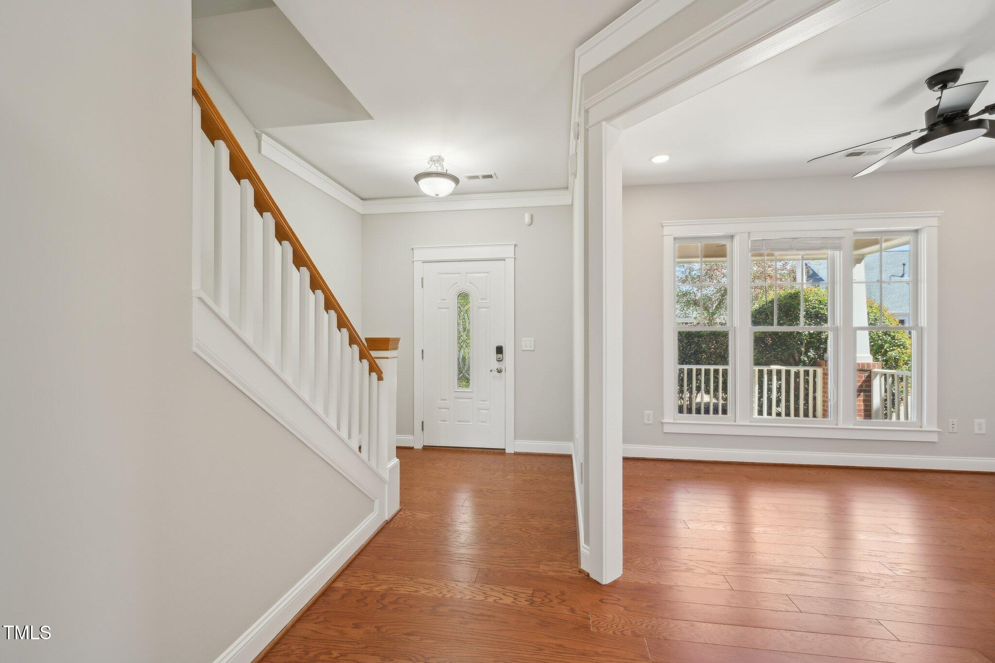 304 Frontgate Drive Cary, NC 27519 - Photo 4 of 41 wooden floor in an empty room with a window