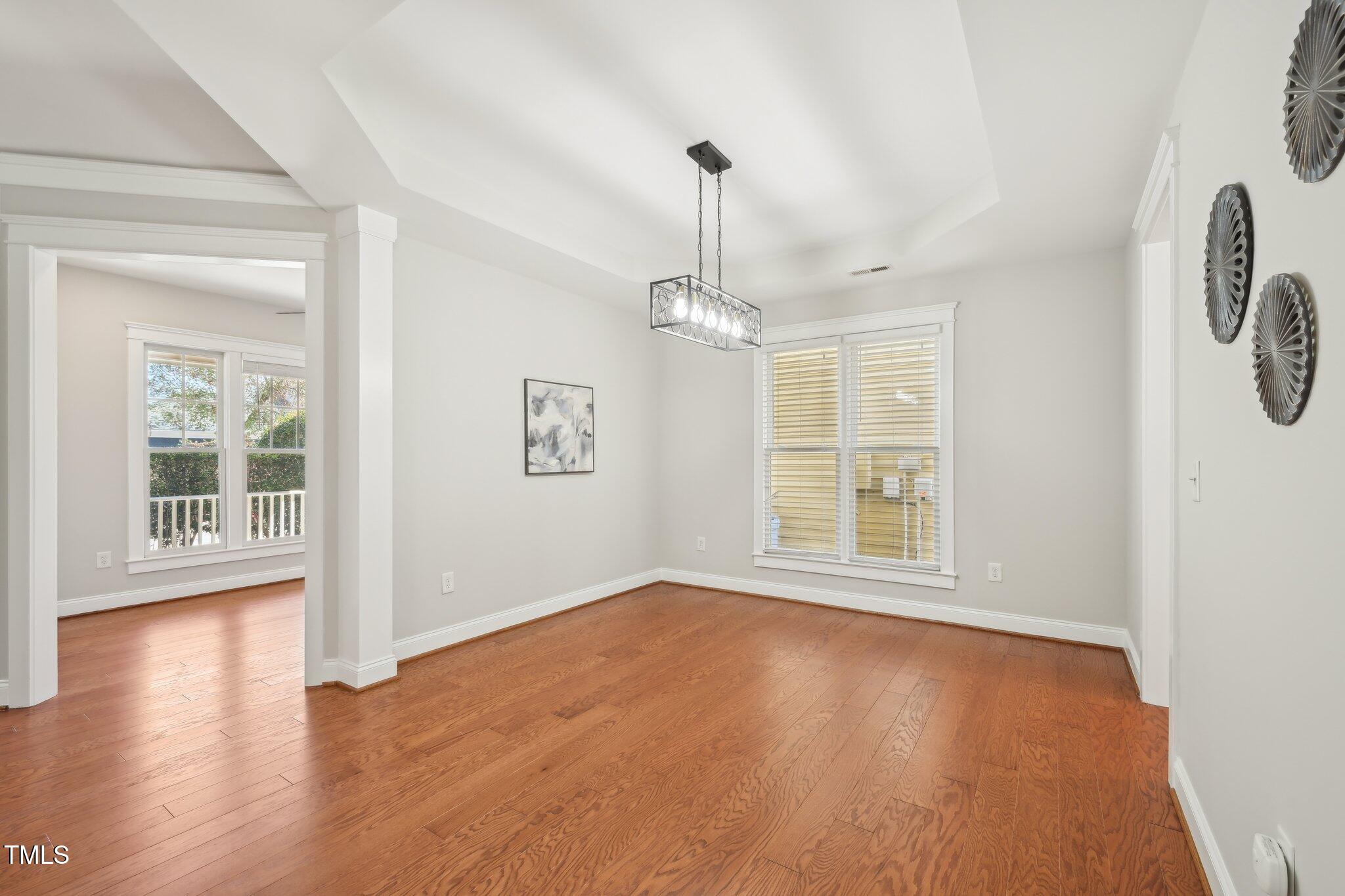 304 Frontgate Drive Cary, NC 27519 - Photo 6 of 41 wooden floor in an empty room with a window