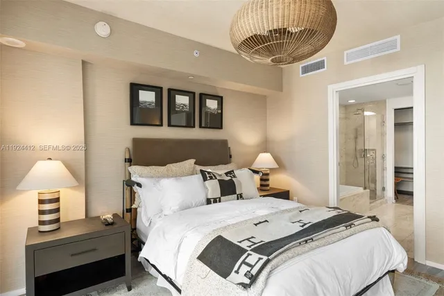 a spacious bathroom with a granite countertop shower a sink and a mirror