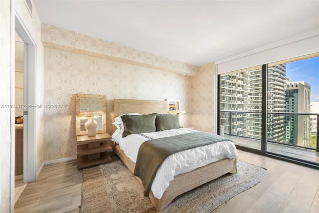 a bathroom with a double vanity sink a toilet and shower