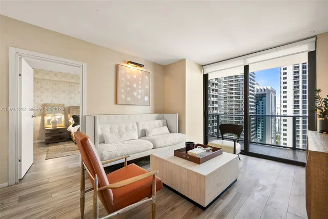 a living room with furniture and a large window