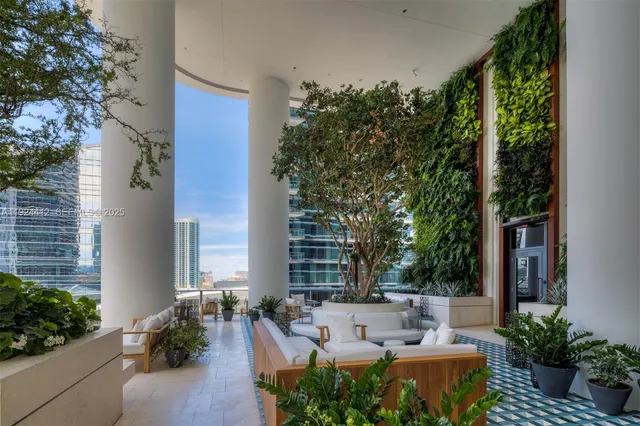 a view of a house with a yard and a patio