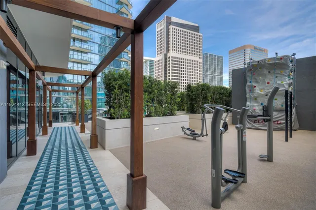 a bedroom with bed and a large mirror
