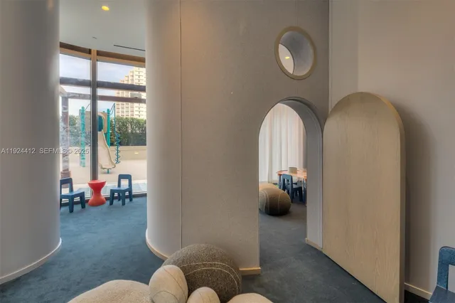 a bedroom with furniture or couch and a potted plant