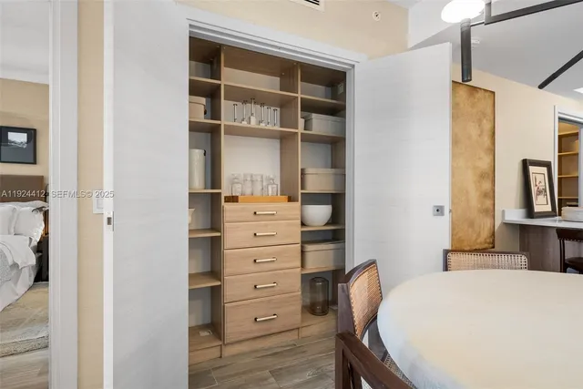 a bedroom with a bed and furniture