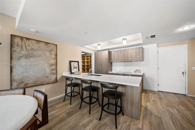 a kitchen with granite countertop a sink and stove