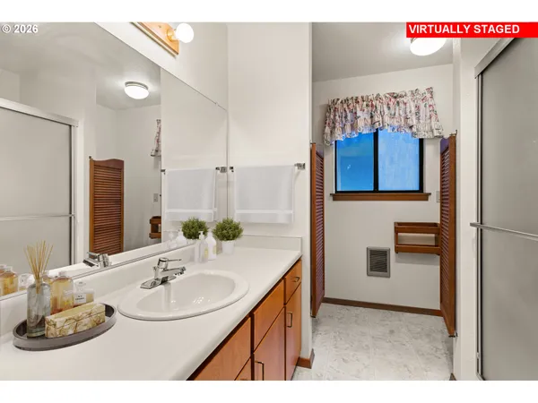 a bathroom with a sink and a mirror