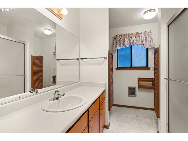 a bathroom with a sink and a mirror