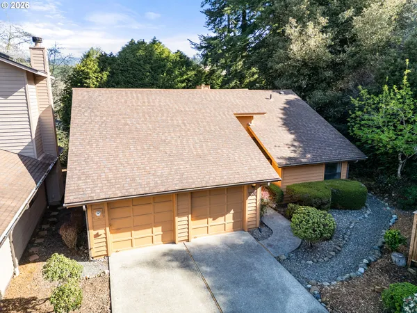 a view of a house with a backyard