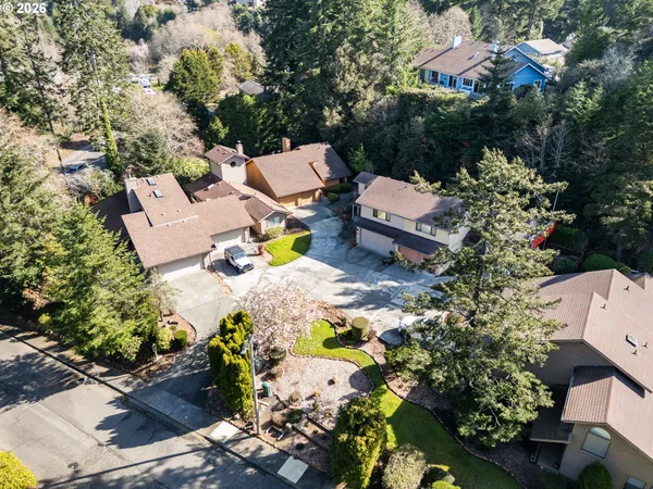 an aerial view of a house with a yard basket ball court and outdoor seating