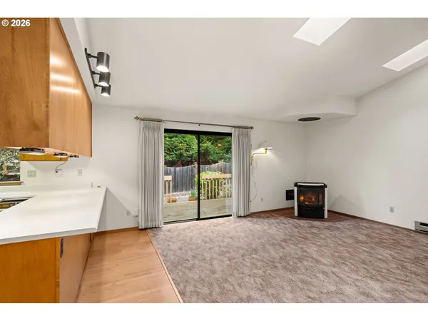 a view of a kitchen with a sink and a window