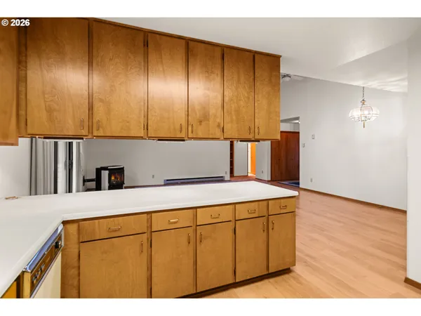 a kitchen with kitchen island a stove a sink and a refrigerator