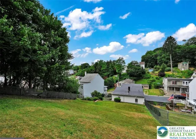 a view of house with garden space and street view