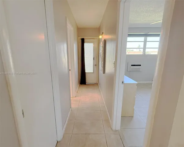 a view of a hallway with two rooms