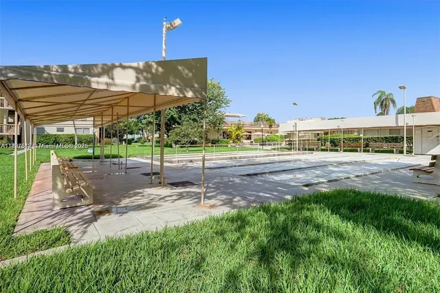 a view of a building with a yard