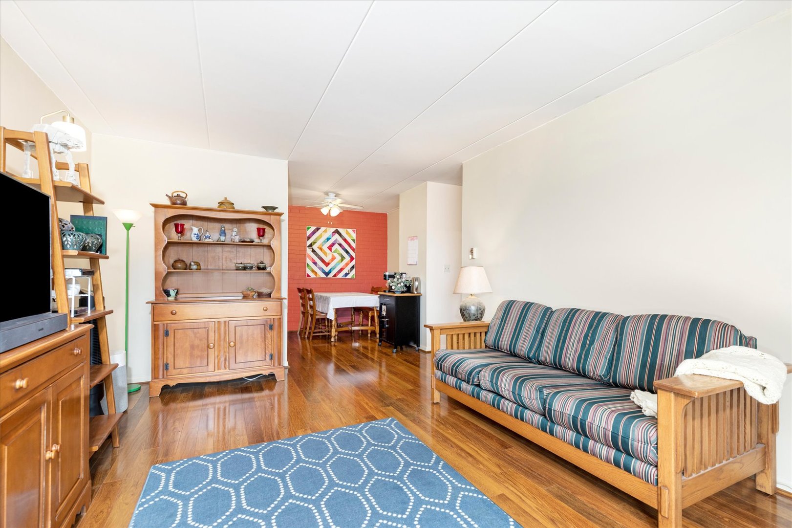 300 Circle Avenue, Unit 5H Forest Park, IL 60130 - Photo 12 of 21 a living room with furniture and a flat screen tv