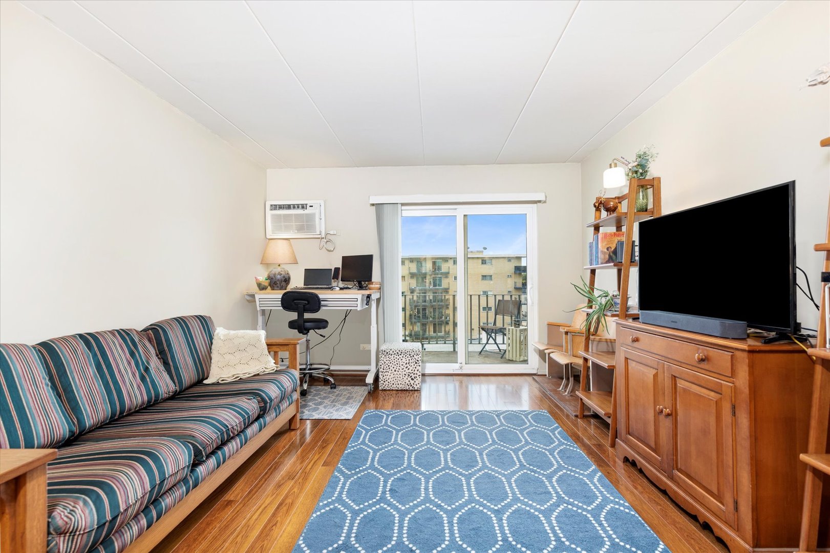 300 Circle Avenue, Unit 5H Forest Park, IL 60130 - Photo 5 of 21 a living room with furniture and a flat screen tv