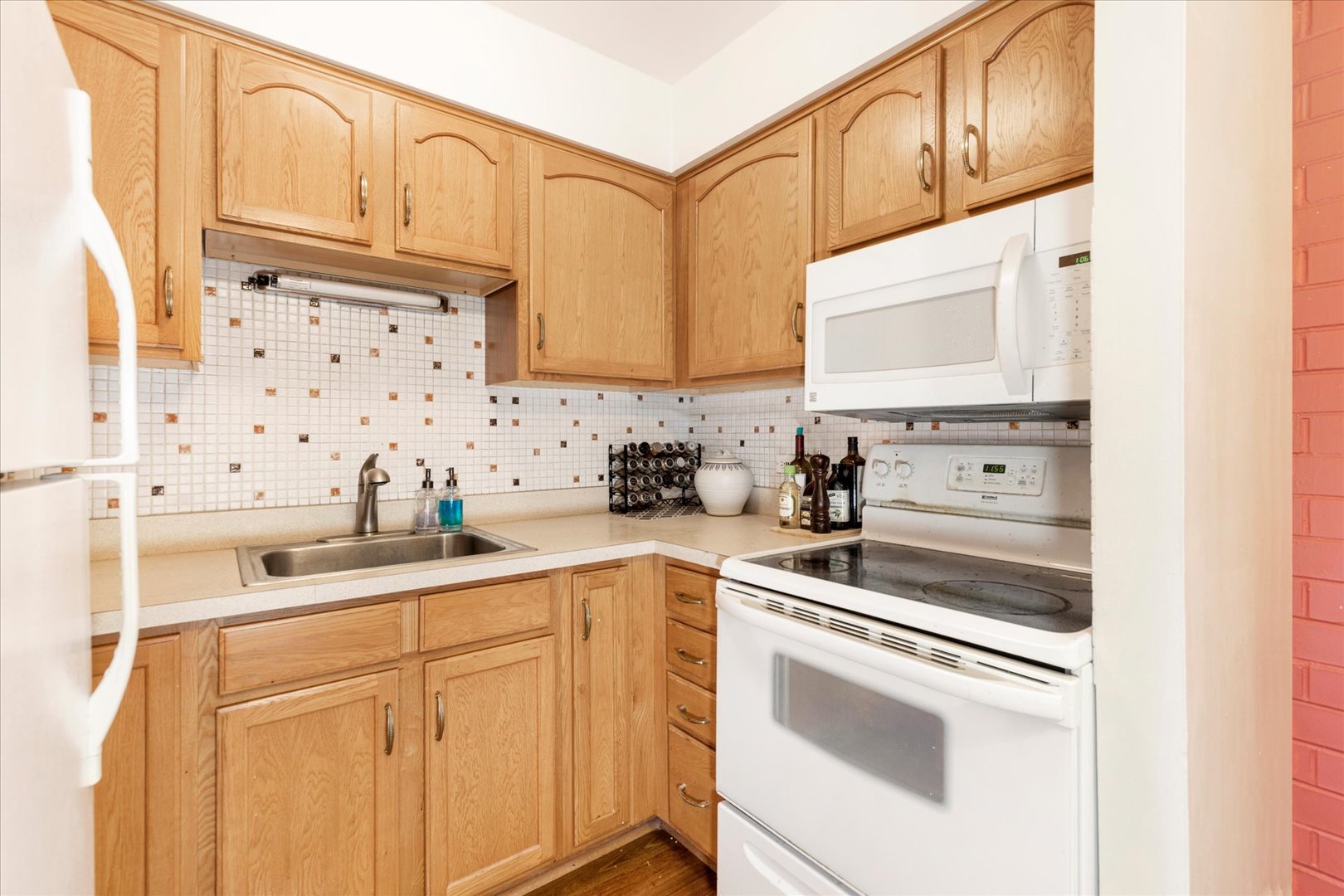 300 Circle Avenue, Unit 5H Forest Park, IL 60130 - Photo 7 of 21 a kitchen with stainless steel appliances granite countertop white cabinets a sink and dishwasher