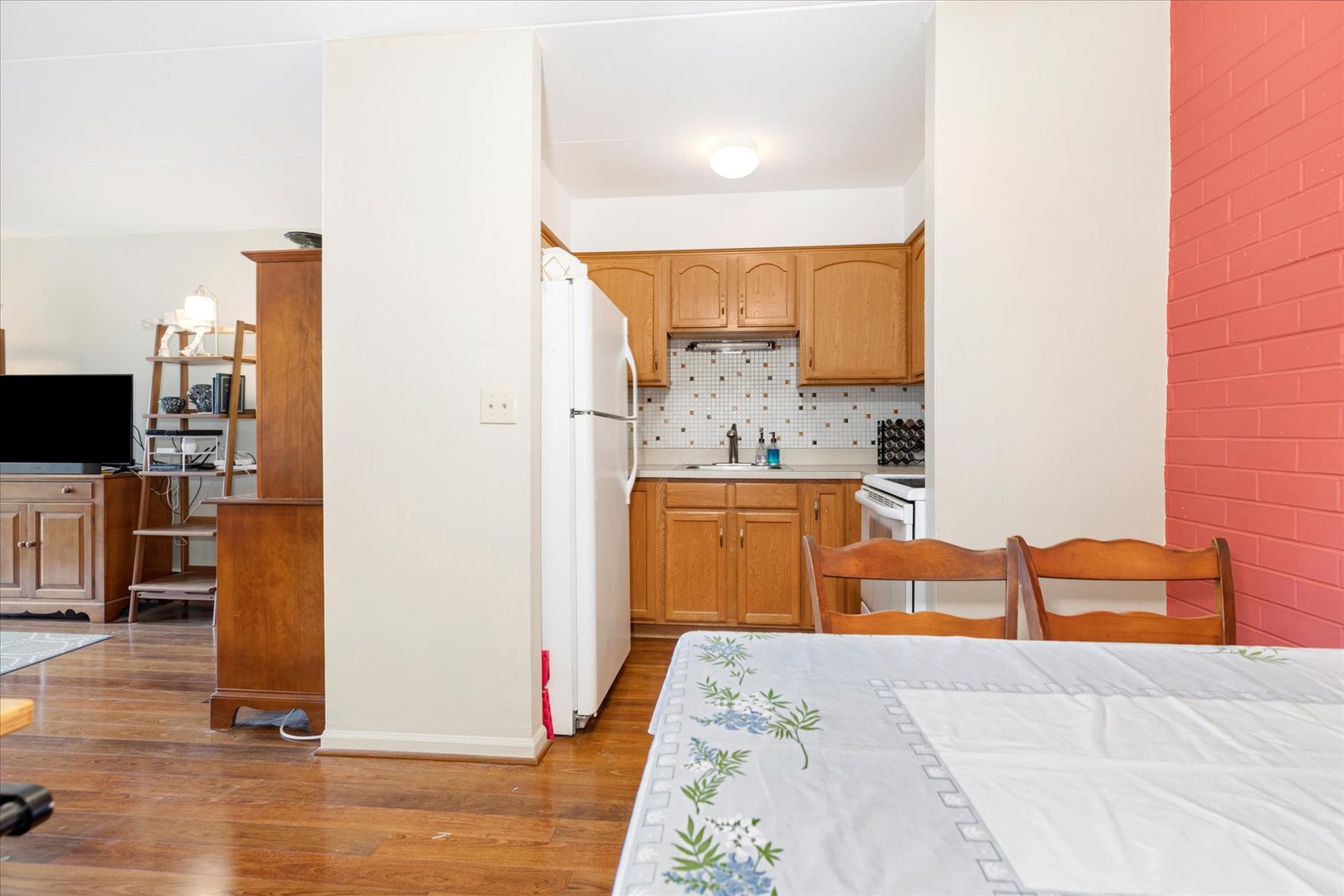 300 Circle Avenue, Unit 5H Forest Park, IL 60130 - Photo 8 of 21 a bedroom with a bed and a television
