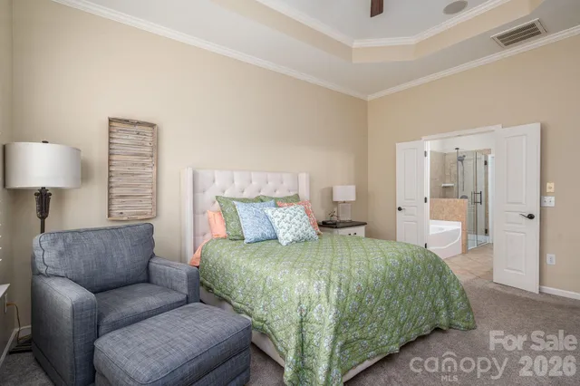 a bedroom with a bed and a couch