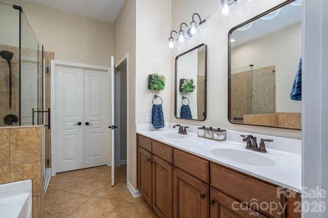 a bathroom with a double vanity sink mirror and double
