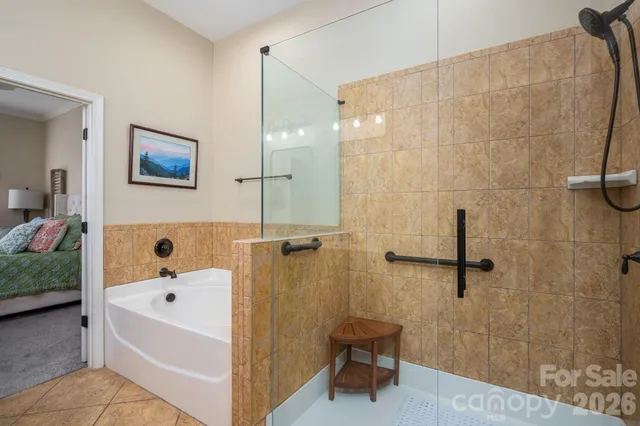 a bathroom with a bathtub and a shower