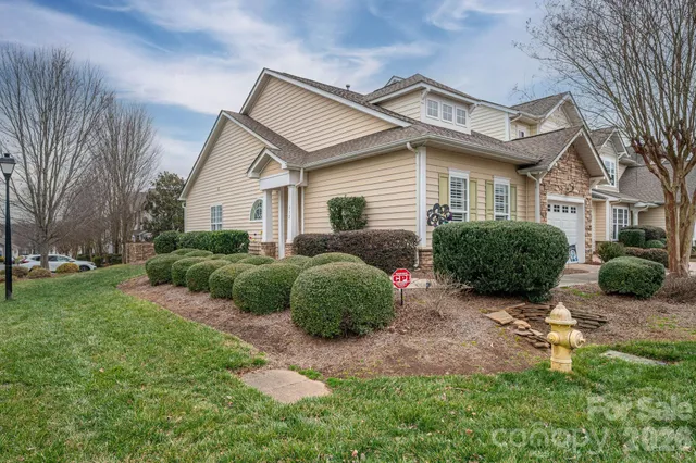 a view of a front of a house with a small yard