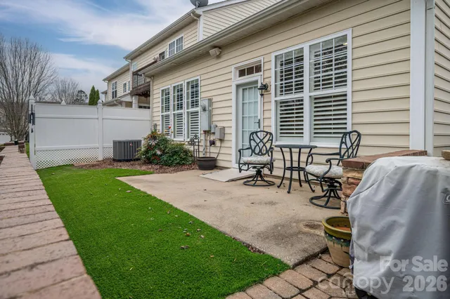 a view of a backyard with sitting area and furniture
