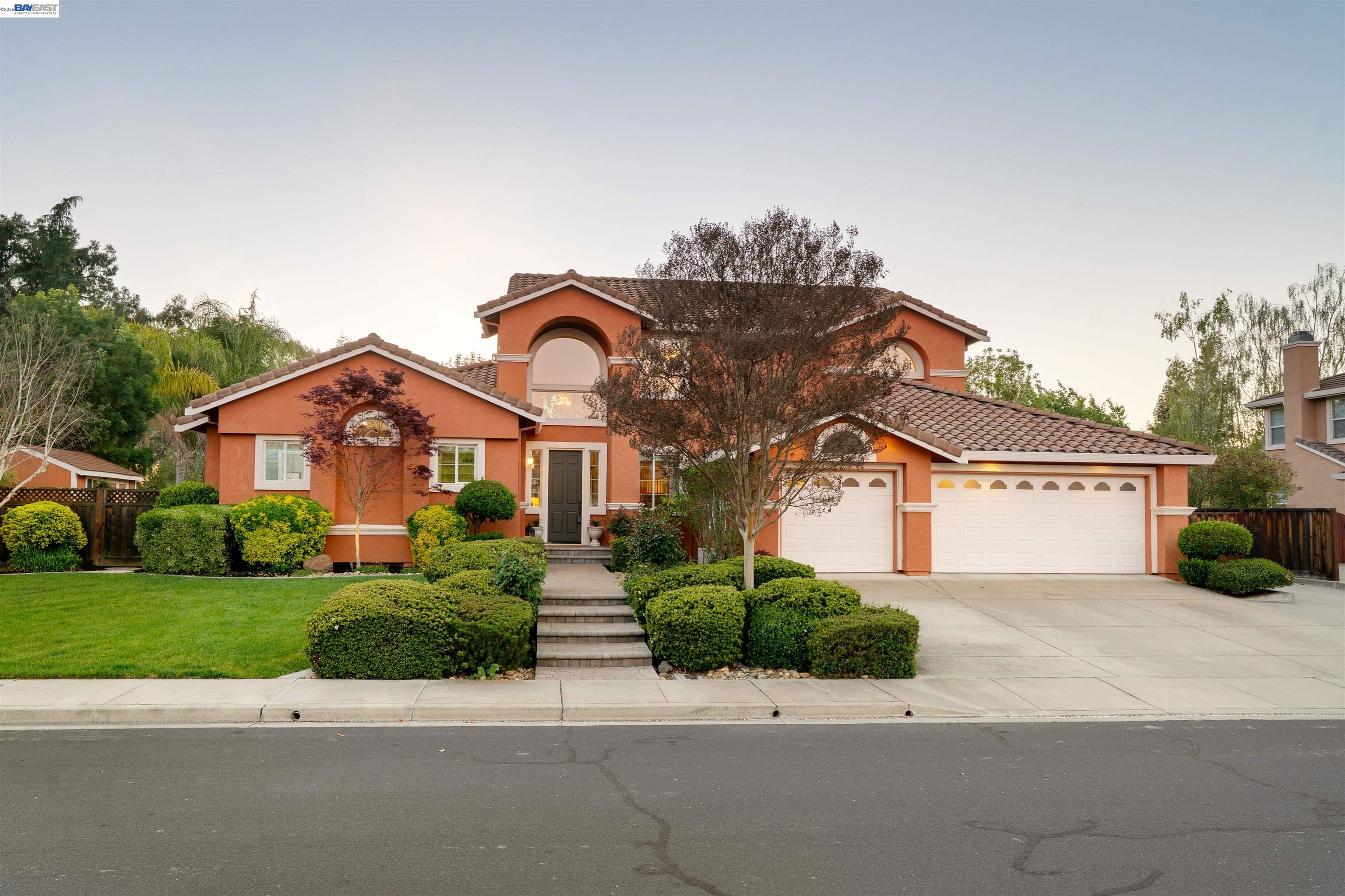 1635 Embassy Circle Livermore, CA 94550 - Photo 1 of 60 a front view of a house with a yard and garage