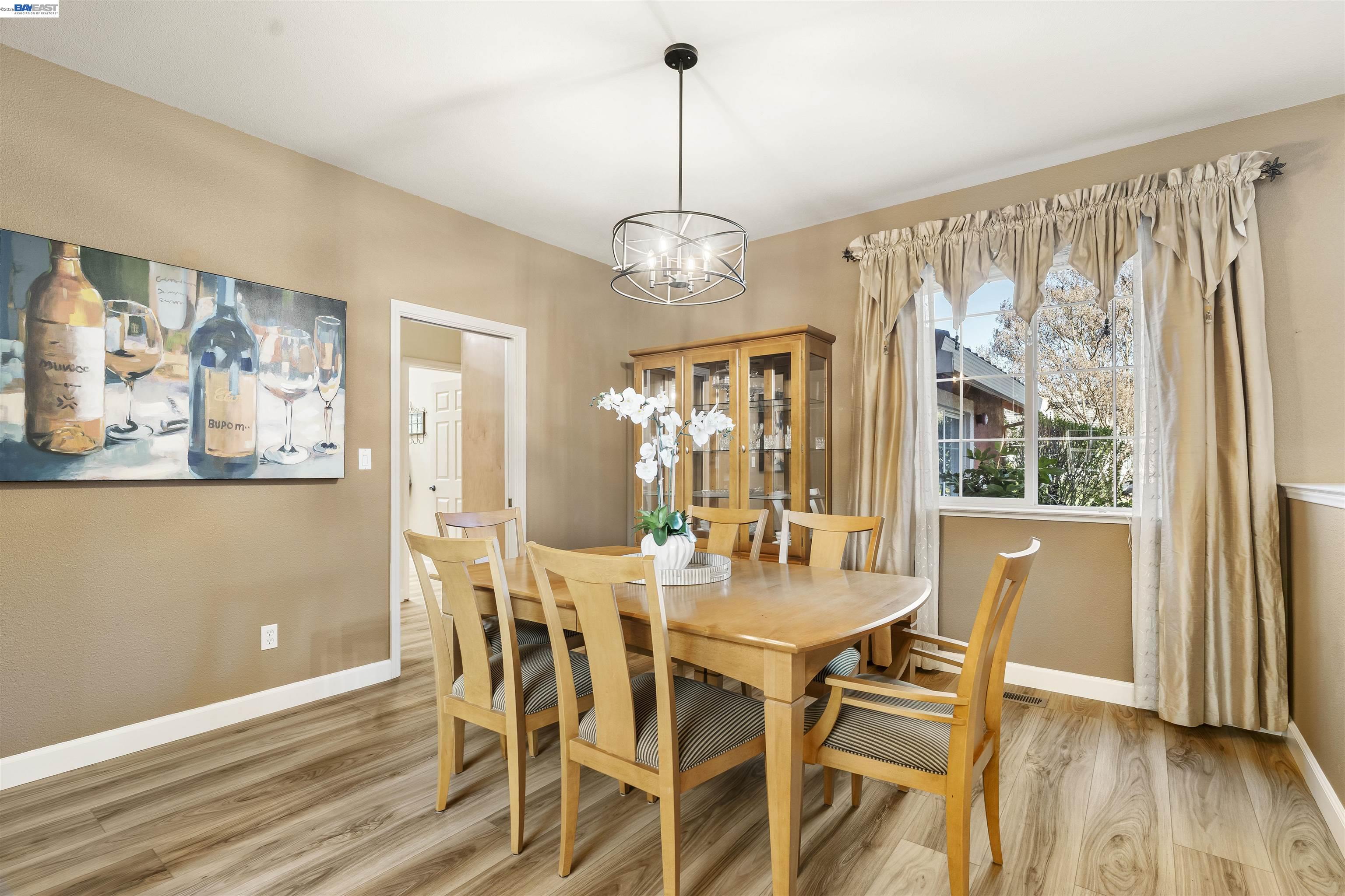 1635 Embassy Circle Livermore, CA 94550 - Photo 13 of 60 a view of a dining room with furniture window and wooden floor