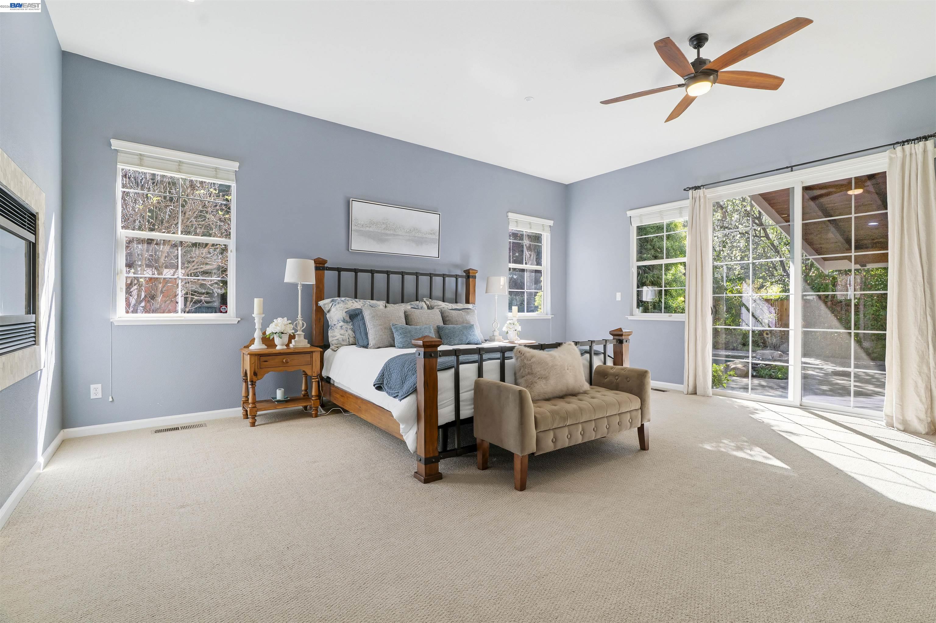 1635 Embassy Circle Livermore, CA 94550 - Photo 14 of 60 a spacious bedroom with a bed and a couch