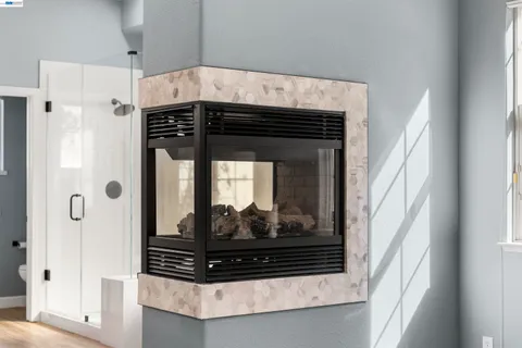 a spacious bathroom with stainless steel appliances double vanity sink and mirror