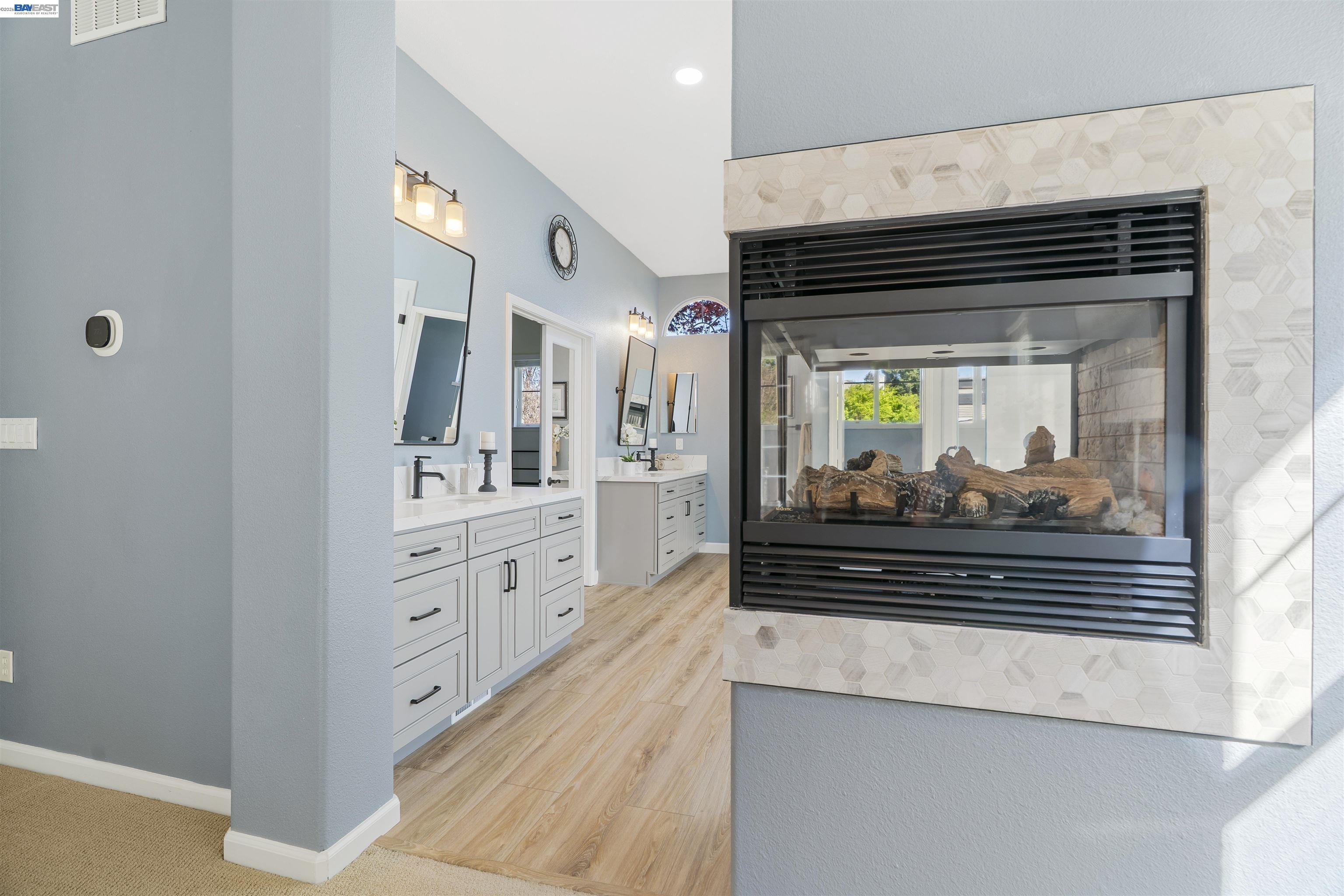 1635 Embassy Circle Livermore, CA 94550 - Photo 18 of 60 a kitchen with stainless steel appliances a stove and cabinets