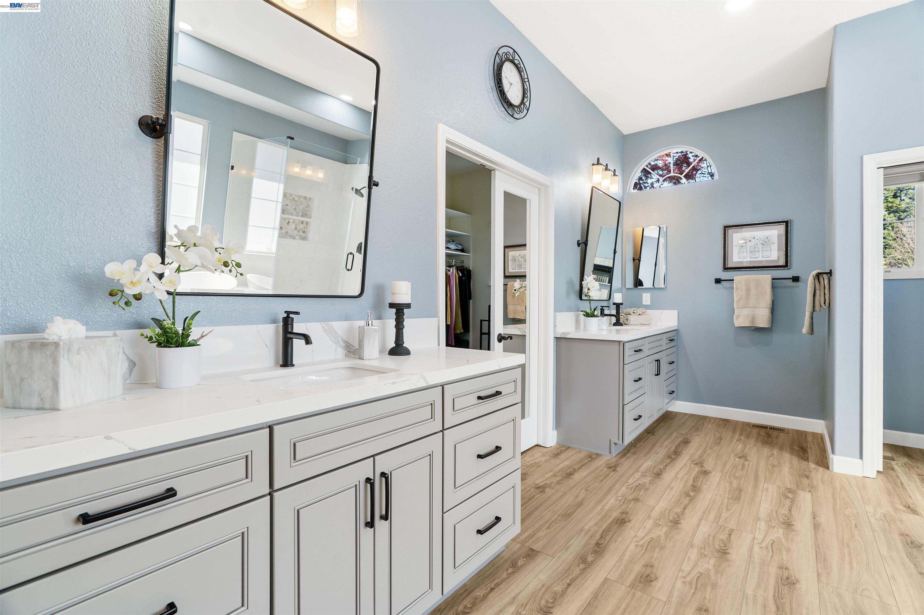 1635 Embassy Circle Livermore, CA 94550 - Photo 19 of 60 a spacious bathroom with stainless steel appliances double vanity sink and mirror