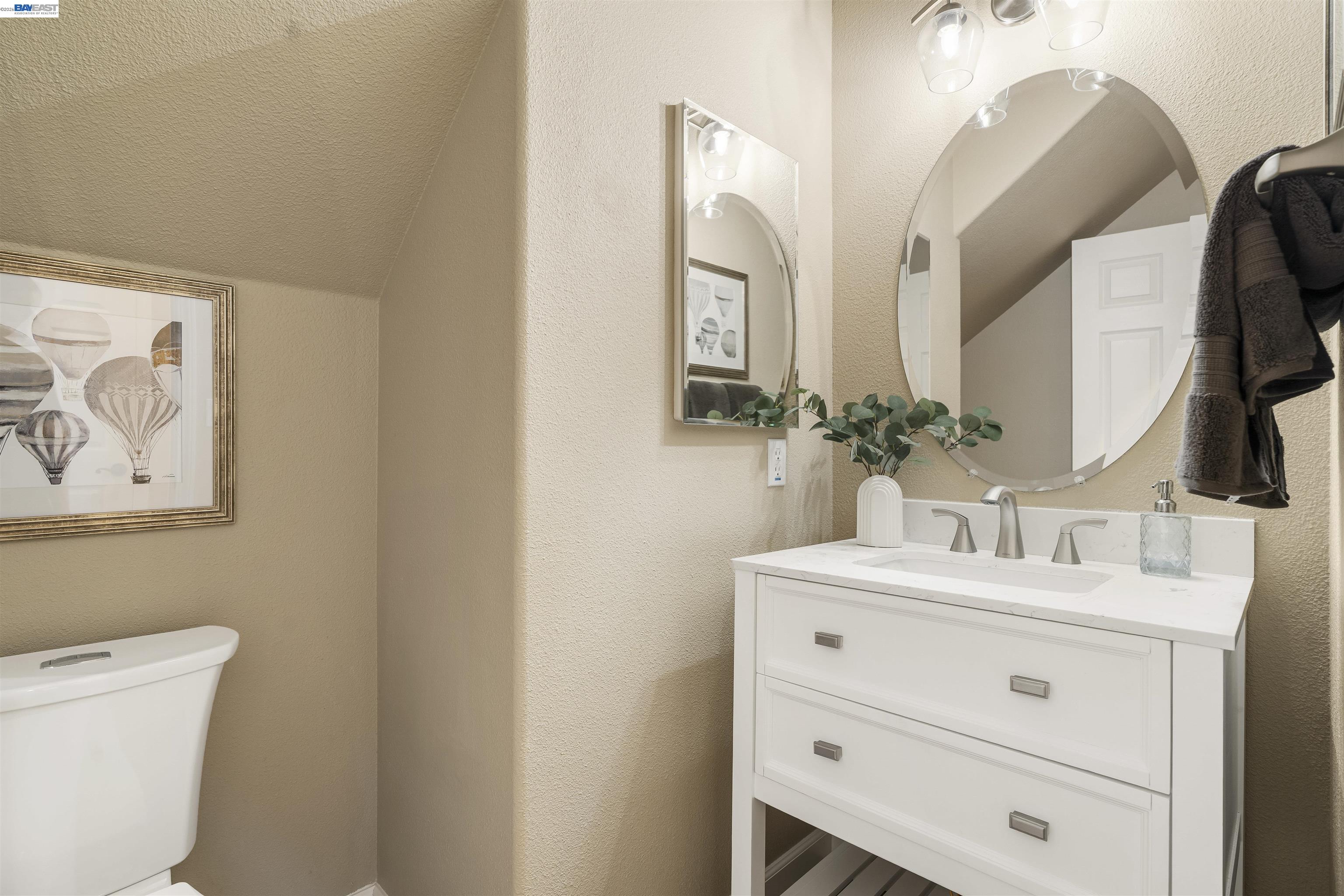 1635 Embassy Circle Livermore, CA 94550 - Photo 36 of 60 a bathroom with a sink vanity and a mirror