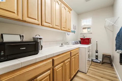 a bathroom with a tub sink and vanity