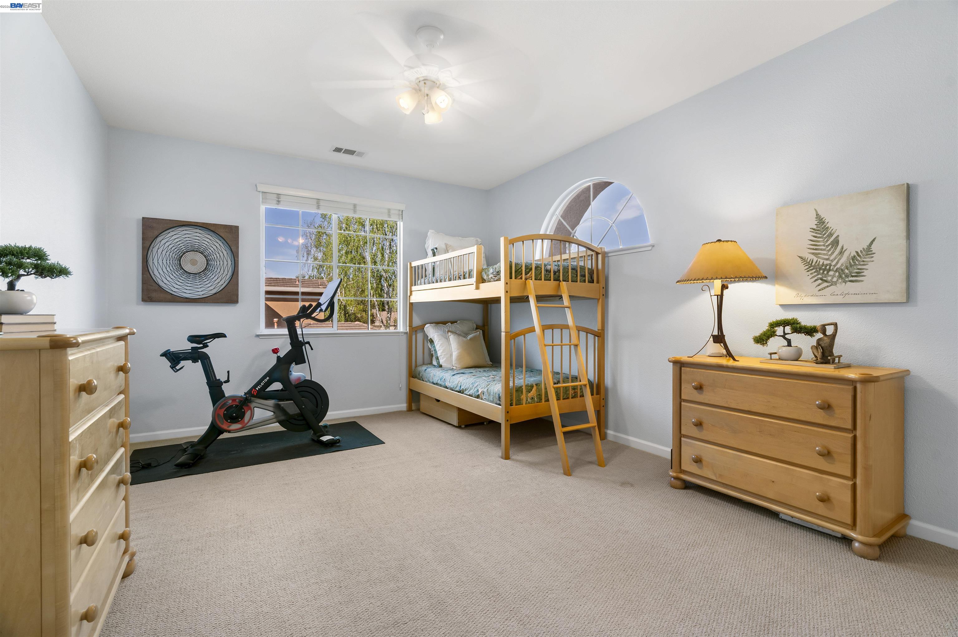1635 Embassy Circle Livermore, CA 94550 - Photo 40 of 60 a bedroom with bed and a chandelier