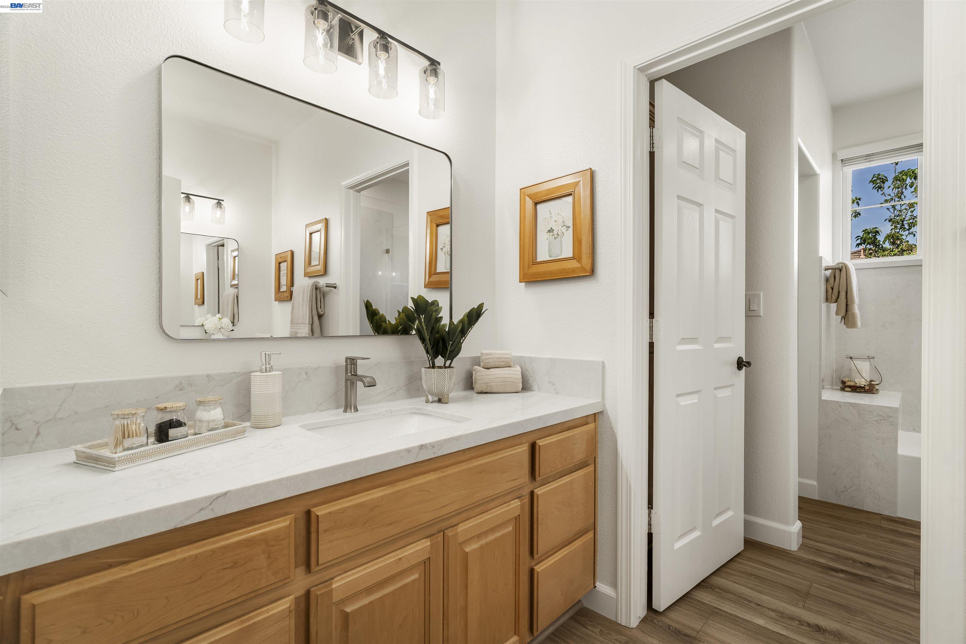 1635 Embassy Circle Livermore, CA 94550 - Photo 41 of 60 a bathroom with a double vanity sink mirror and