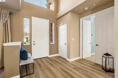 a view of a bedroom with wooden floor and bedroom