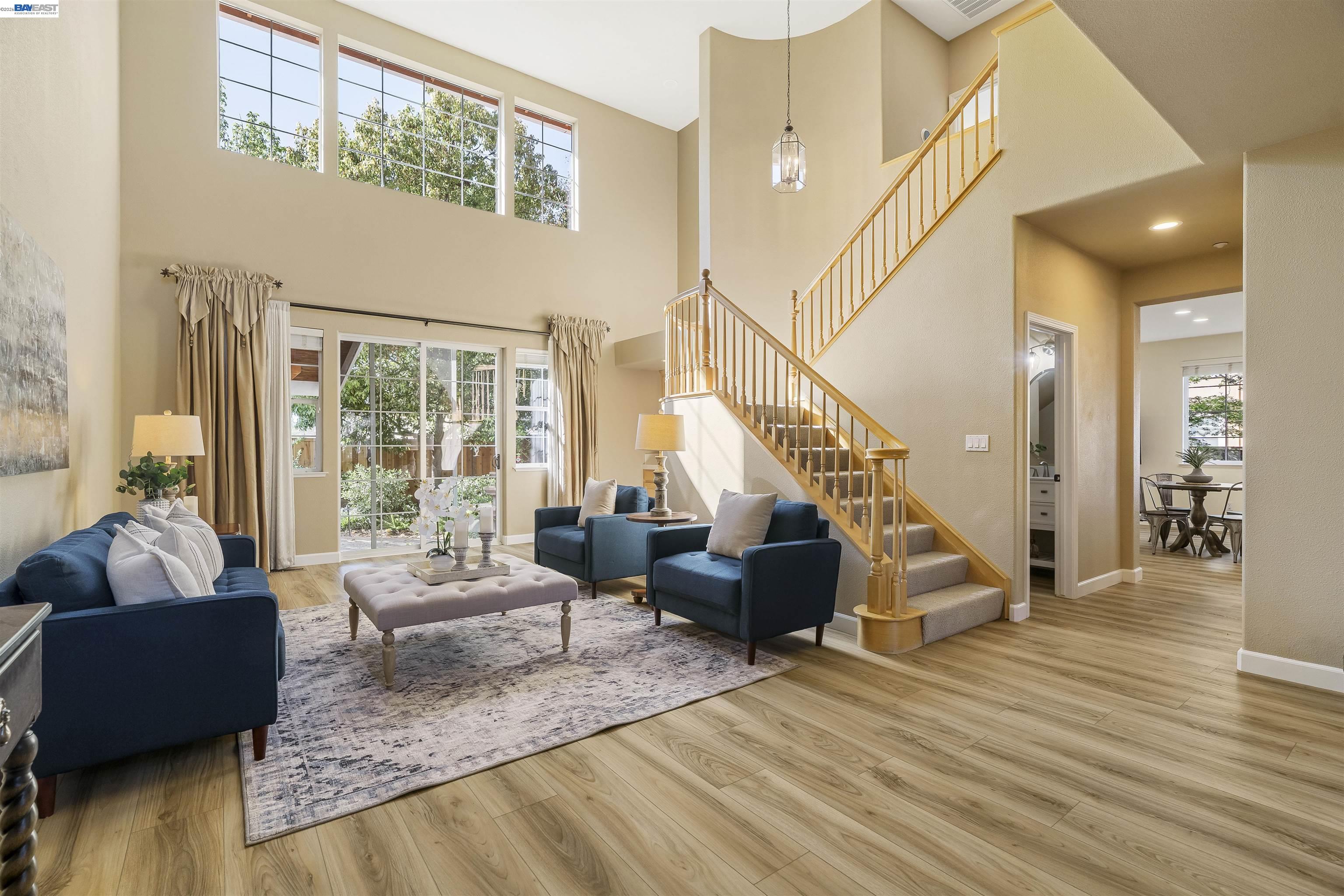 1635 Embassy Circle Livermore, CA 94550 - Photo 6 of 60 a living room with furniture and wooden floor