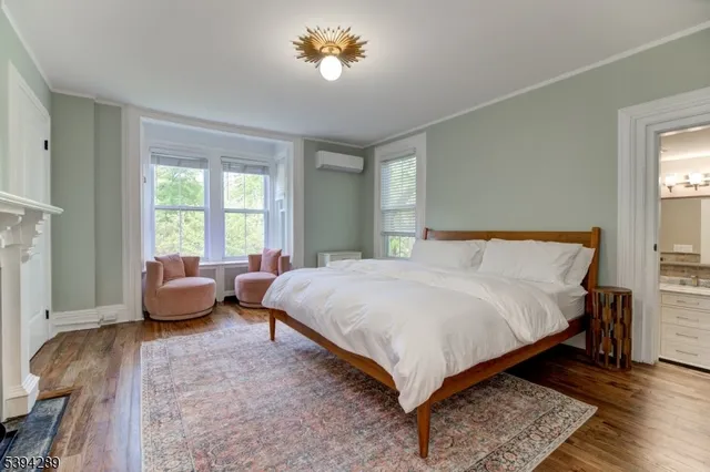 a bedroom with a bed and a couch